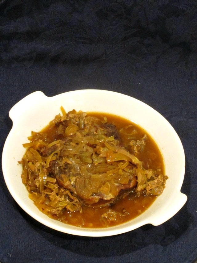 Easy Pot Roast with gravy in a white plate