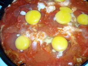 Adding Eggs to Tomatoes