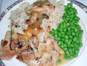Chicken and sauce, served with rice and peas - Inhabited Kitchen