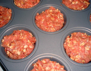 Filling tin with meat mixture - Inhabited Kitchen