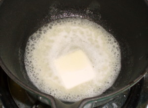 Melting butter into lemon juice - www.inhabitedkitchen.com
