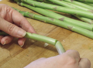snapping ends off asparagus - www.inhabitedkitchen.com