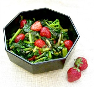 Sweet red strawberries nestled in savory sauteed spinach - a wonderful vegetable dish to celebrate the beginning of summer!