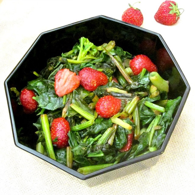 Sweet red strawberries nestled in savory sauteed spinach - a wonderful vegetable dish to celebrate the beginning of summer!