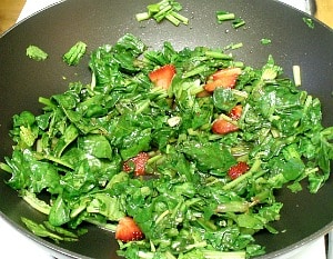 Sweet red strawberries nestled in savory sauteed spinach - a wonderful vegetable dish to celebrate the beginning of summer!