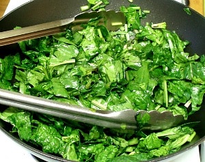 Sweet red strawberries nestled in savory sauteed spinach - a wonderful vegetable dish to celebrate the beginning of summer!