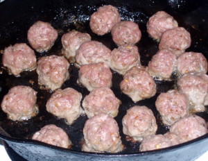 Starting to cook the meatballs - www.inhabitedkitchen.com