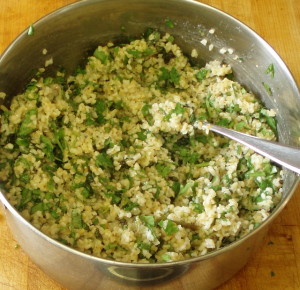 Mixing herbs into tabbouli - www.inhabitedkitchen.com