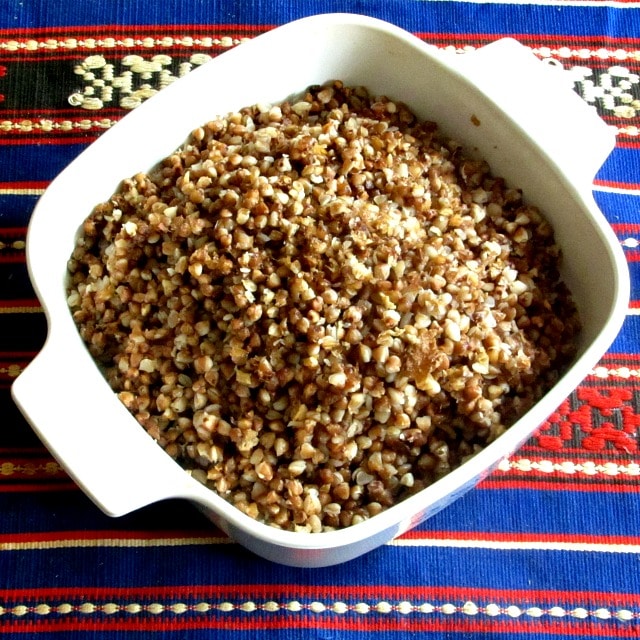 Serving dish of kasha on blue table runner