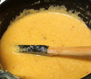 Stirring chipotle cheese sauce - www.inhabitedkitchen.com