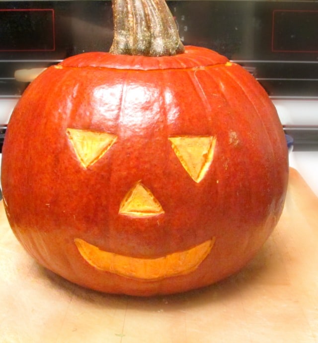 Make a Jack o'Lantern Roast Sutuffed Pumpkin, for a perfect festive Halloween dinner! 