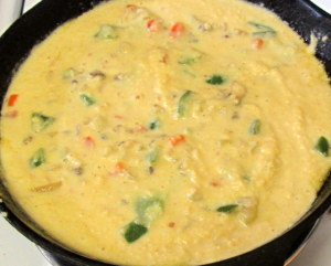 Cornbread batter in cast iron pan - www.inhabitedkitchen.com