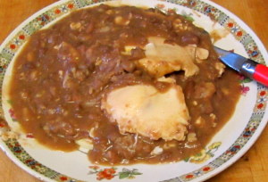 Breakfast - Beans and eggs over tortillas