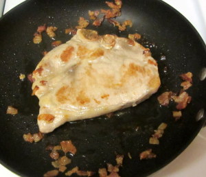 Brown pork chop in bacon fat - www.inhabitedkitchen.com