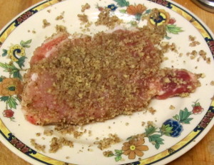 Coating pork chop with chopped pecans - www.inhabitedkitchen.com