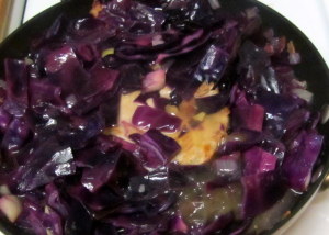 Pork simmering in red cabbage and broth - www.inhabitedkitchen.com