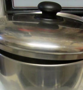 Pot lid ajar to avoid soup boiling over - www.inhabitedkitchen.com