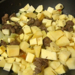 Vegetables simmering for stew - www.inhabitedkitchen.com