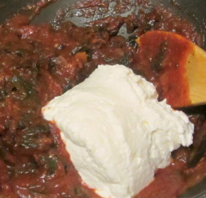 Adding ricotta to pasta sauce - www.inhabitedkitchen.com