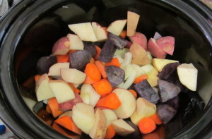 Slow cooker full of vegetables for pot roast - www.inhabitedkitchen.com