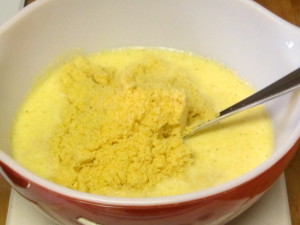 Adding corn muffin mix to wet ingredients - www.inhabitedkitchen.com