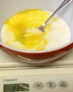 Adding milk to egg to make muffins - www.inhabitedkitchen.com
