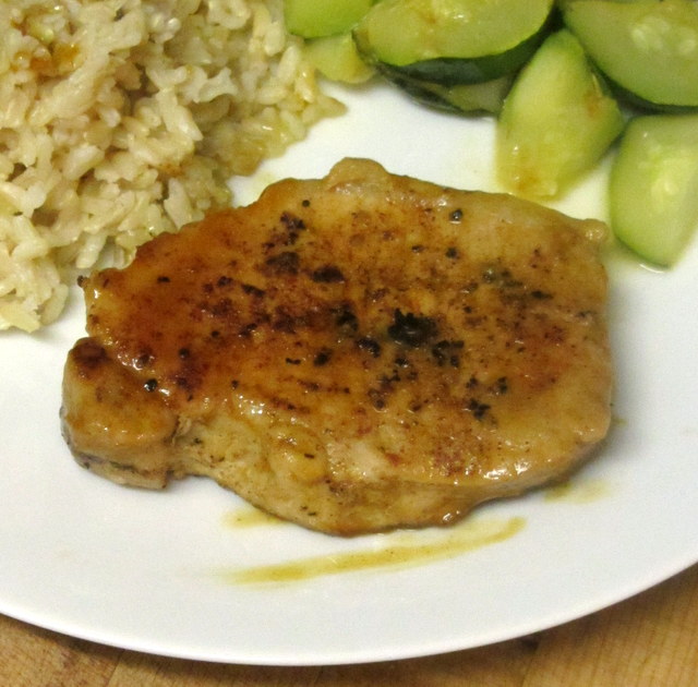 Spiced orange pork chops - spiced and braised in OJ for a sweet and savory treat. www.inhabitedkitchen.com