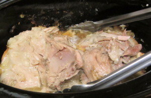 Pulling pork apart into chunks and shreds - www.inhabitedkitchen.com
