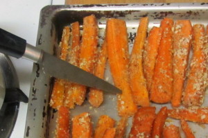 Testing baked carrots for tenderness - www.inhabitedkitchen.com