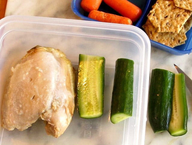 Cold baked chicken as part of a packed meal. 