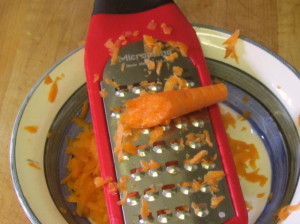Shredding carrots with a hand grater - www.inhabitedkitchen.com