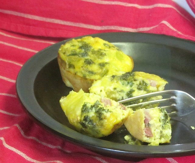 Bake mini egg and ham muffins, then reheat for a quick breakfast! www.inhabitedkitchen.com