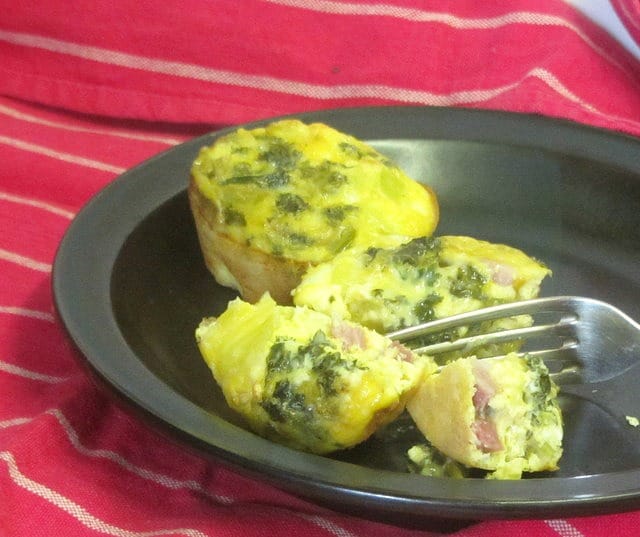 Bake mini egg and ham muffins, then reheat for a quick breakfast! www.inhabitedkitchen.com