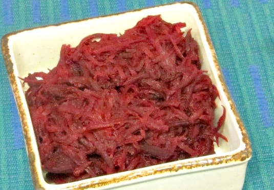 Shred beets and saute them in butter - with a little orange juice to brighten them - for a lighter feeling vegetable - www.inhabitedkitchen.com