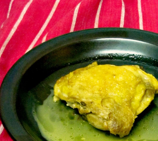 Chicken thighs braised in orange juice with a touch of ginger to add depth - easy and delicious! www.inhabitedkitchen.com