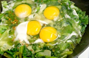 Simmer greens in broth and cook your eggs nestled right in them for a quick and easy meal of greens and eggs. www.inhabitedkitchen.com