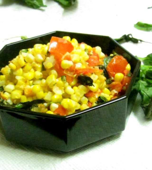 Very lightly saute fresh corn and tomatoes for a delicious and easy vegetable recipe that tastes like summer. www.inhabitedkitchen.com