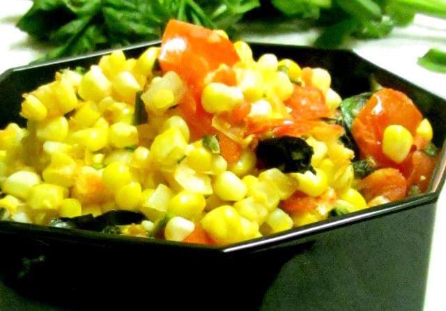 Very lightly saute fresh corn and tomatoes for a delicious and easy vegetable recipe that tastes like summer. www.inhabitedkitchen.com