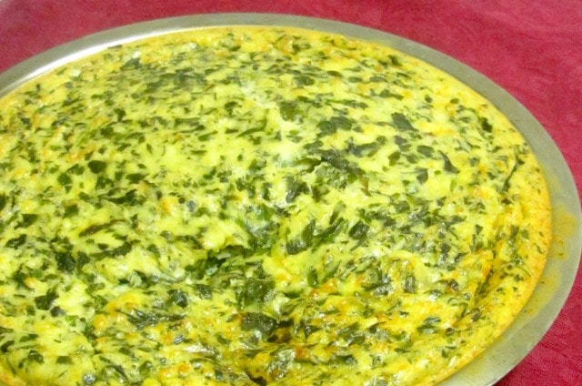 Use cooked chard - or other greens - to make a chard crustless quiche. Serve hot or cold, lunch or dinner! www.inhabitedkitchen.com