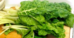 Use cooked chard - or other greens - to make a chard crustless quiche. Serve hot or cold, lunch or dinner! www.inhabitedkitchen.com