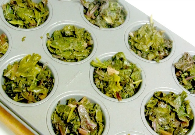 Freeze cooked greens - leftover or cooked for the purpose - in muffin tins, for convenient single serving sized pieces. www.inhabitedkitchen.com