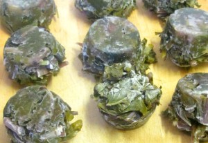 Freeze cooked greens - leftover or cooked for the purpose - in muffin tins, for convenient single serving sized pieces. www.inhabitedkitchen.com