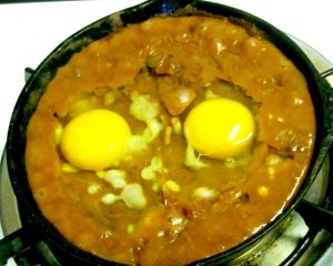A quick, easy, and nutritious breakfast of beans and eggs, with perhaps a sprinkle of cheese, served over corn tortillas. www.inhabitedkitchen.com