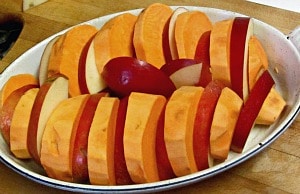 Bake sweet potatoes with apples, for an attractive, elegant, slightly sweet presentation. 