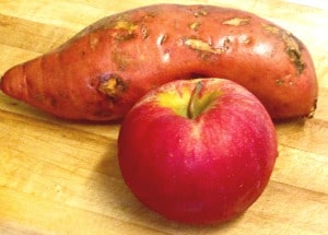 Bake sweet potatoes with apples, for an attractive, elegant, slightly sweet presentation. 