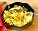Simple sauteed cabbage with Harissa - a North African combination of hot peppers and spices, that adds both heat and complex flavor.