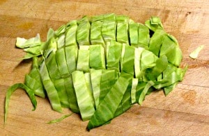 Simple sauteed cabbage with Harissa - a North African combination of hot peppers and spices, that adds both heat and complex flavor.