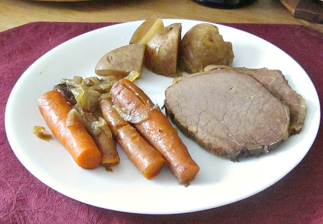 Pot Roast in mushroom broth - simmered in a slow cooker for an easy, richly flavored meal. Thicken the broth if you want gravy! 