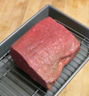 Slow Roast Beef is a method to roast tougher cuts of beef such as round with a lower temperature to make beautiful tender roast beef. 