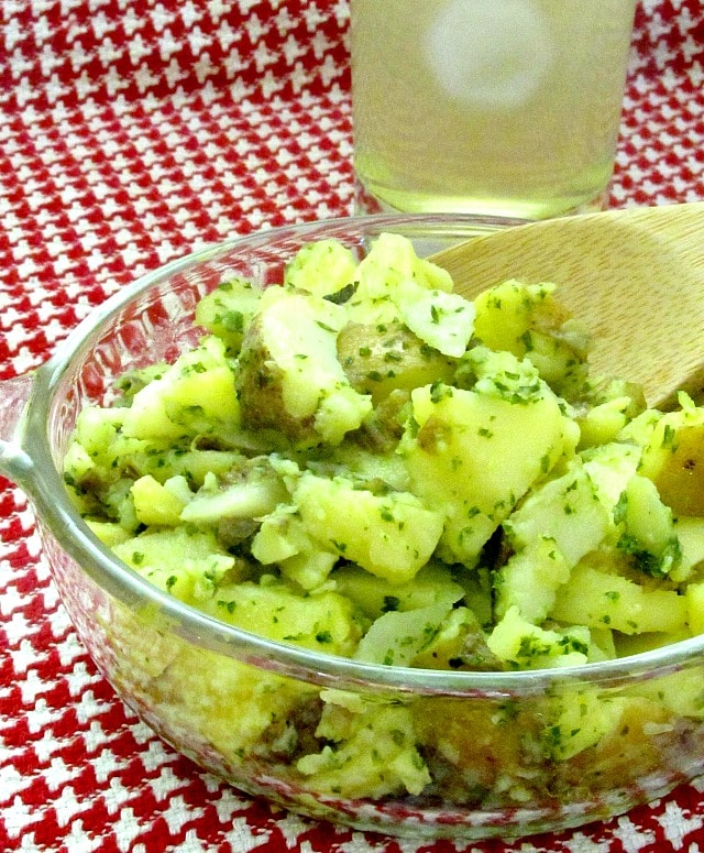 Potato salad made with an herbed oil and vinegar dressing - excellent for lunch boxes, picnics, and anyplace you want a lighter salad - and no mayo!